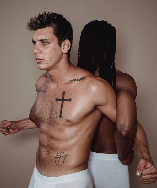 Man performing a controlled strength exercise in a minimalist gym.