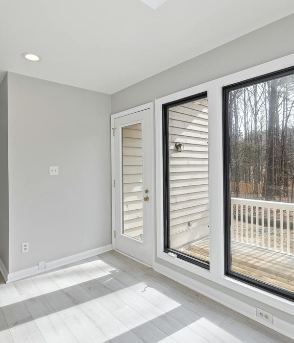 Spacious, well-lit room suitable for home workouts.